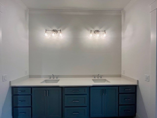 bathroom featuring vanity and ornamental molding