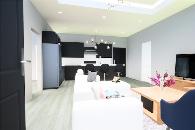 living room featuring light wood-type flooring and a chandelier