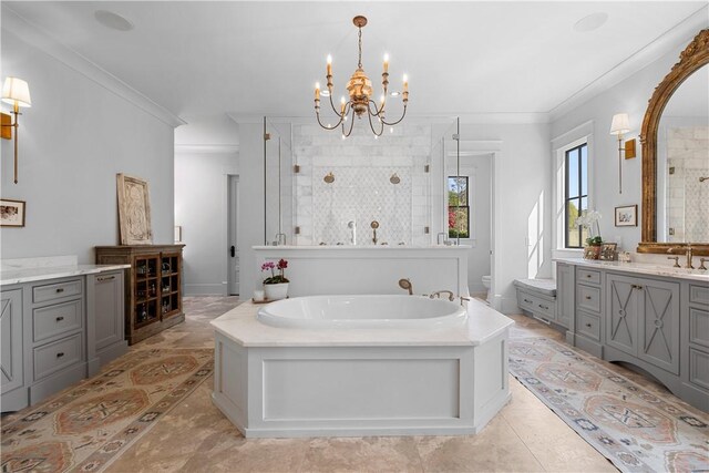 full bathroom featuring crown molding, tiled shower, vanity, and a notable chandelier