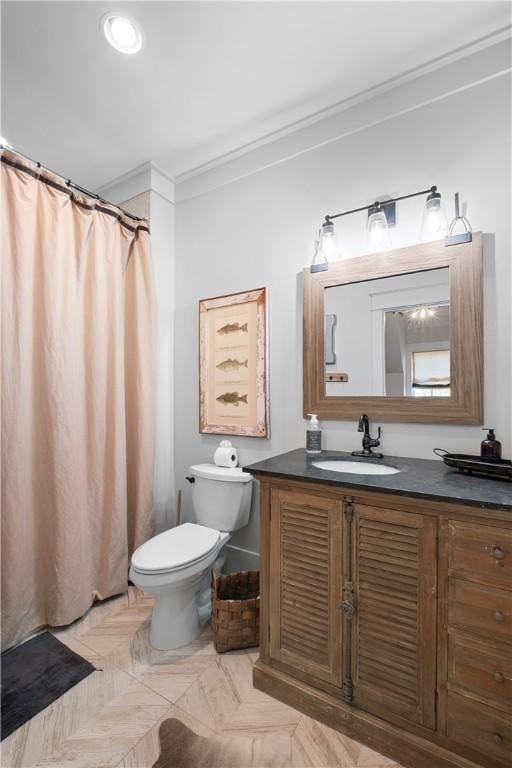 bathroom with toilet, crown molding, vanity, and a shower with curtain