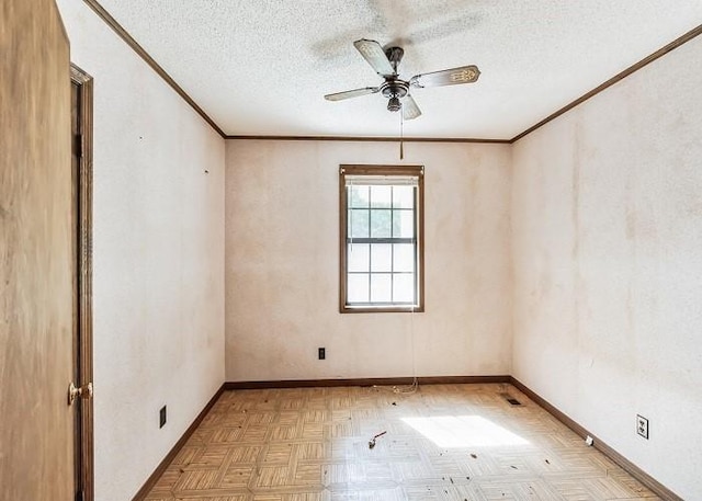 empty room featuring a textured ceiling, light parquet floors, ceiling fan, and crown molding