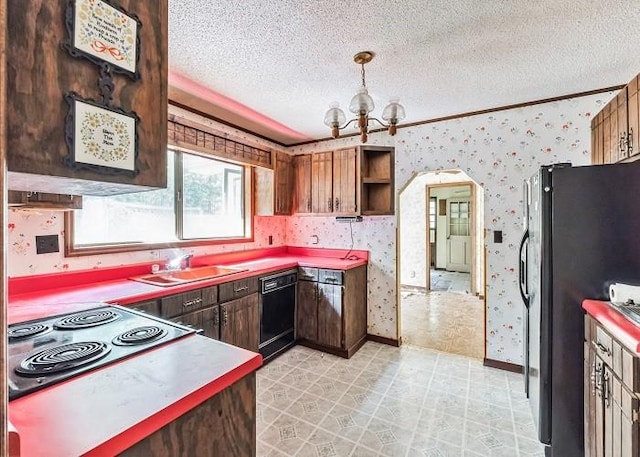 kitchen featuring black appliances, a notable chandelier, sink, and a textured ceiling