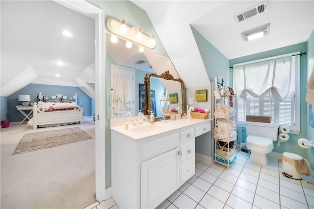 1540 Lakewood Pl, Auburn, AL 36801 - bathroom with tile patterned floors, toilet, vanity, lofted ceiling, and visible vents