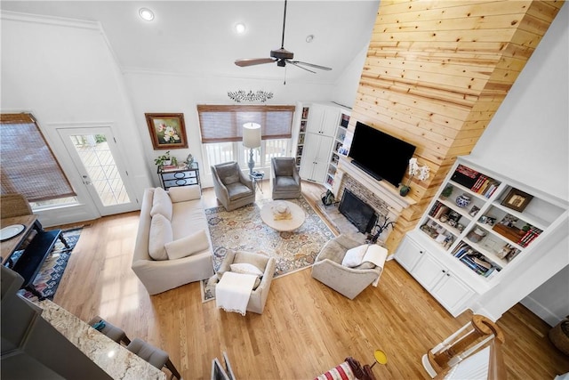 1540 Lakewood Pl, Auburn, AL 36801 - living area featuring a fireplace, high vaulted ceiling, wood finished floors, and ceiling fan