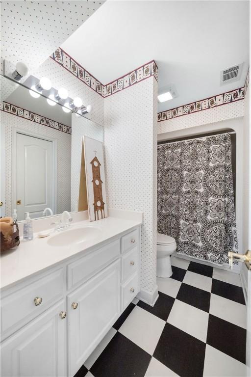 1540 Lakewood Pl, Auburn, AL 36801 - bathroom featuring vanity, toilet, a shower with shower curtain, tile patterned floors, and visible vents