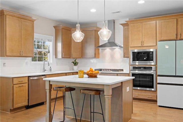 1835 Solamere Ct, Auburn, AL 36832 - kitchen with stainless steel appliances, wall chimney exhaust hood, a center island, decorative backsplash, and light countertops