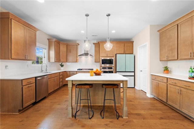 1835 Solamere Ct, Auburn, AL 36832 - kitchen with stainless steel appliances, a breakfast bar area, a kitchen island, light wood finished floors, and recessed lighting