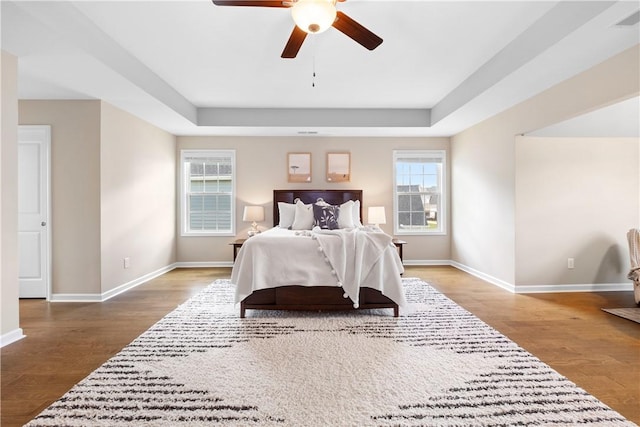 1835 Solamere Ct, Auburn, AL 36832 - bedroom featuring wood finished floors, a raised ceiling, and ceiling fan