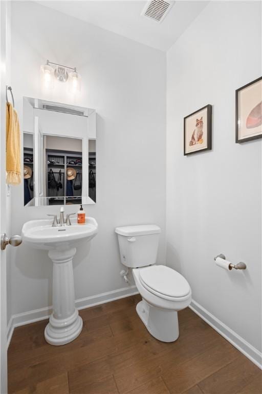 1835 Solamere Ct, Auburn, AL 36832 - half bathroom with toilet and wood finished floors