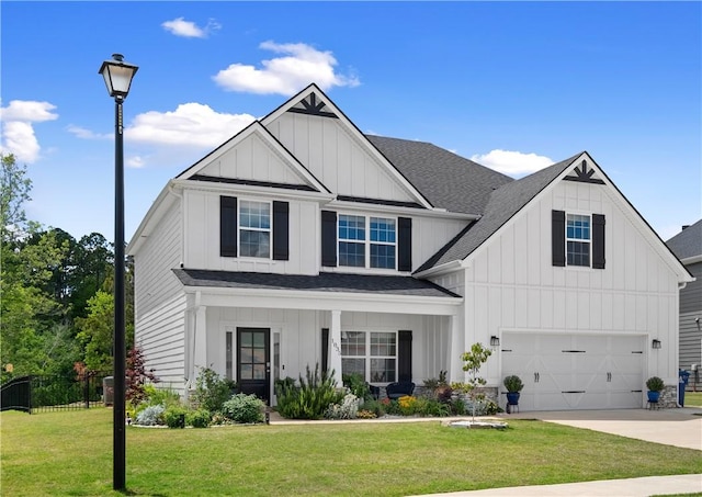 1835 Solamere Ct, Auburn, AL 36832 - view of front facade featuring board and batten siding, a garage, and concrete driveway