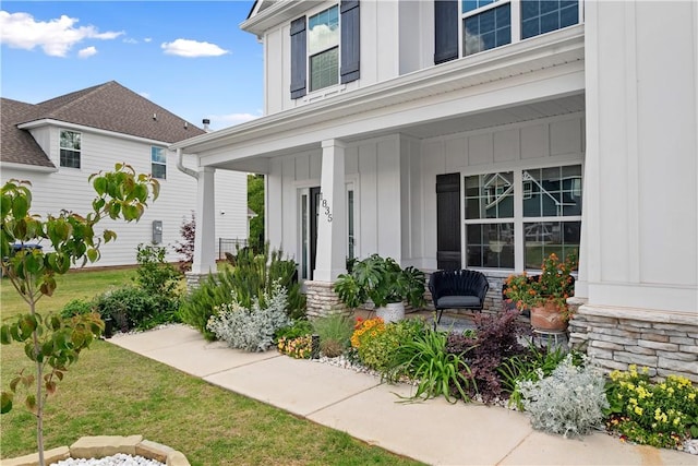 1835 Solamere Ct, Auburn, AL 36832 - doorway to property with board and batten siding and a porch