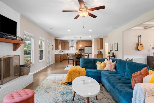 1835 Solamere Ct, Auburn, AL 36832 - living area featuring a fireplace, ceiling fan, wood finished floors, and recessed lighting