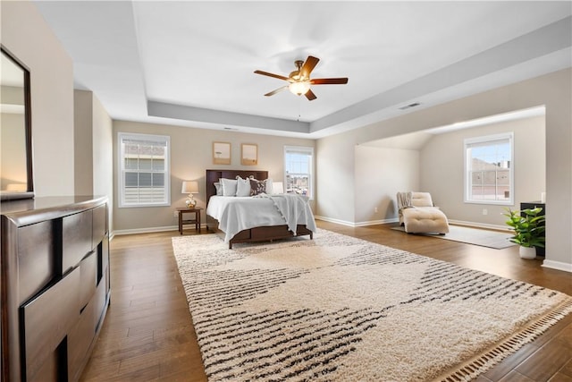 1835 Solamere Ct, Auburn, AL 36832 - bedroom with multiple windows and dark wood-type flooring