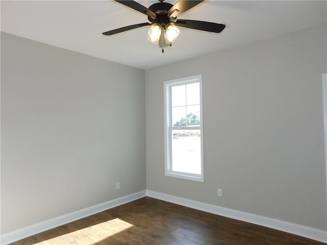 empty room featuring dark hardwood / wood-style floors and ceiling fan