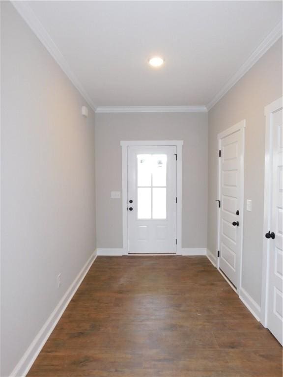 entryway with crown molding and dark wood-type flooring