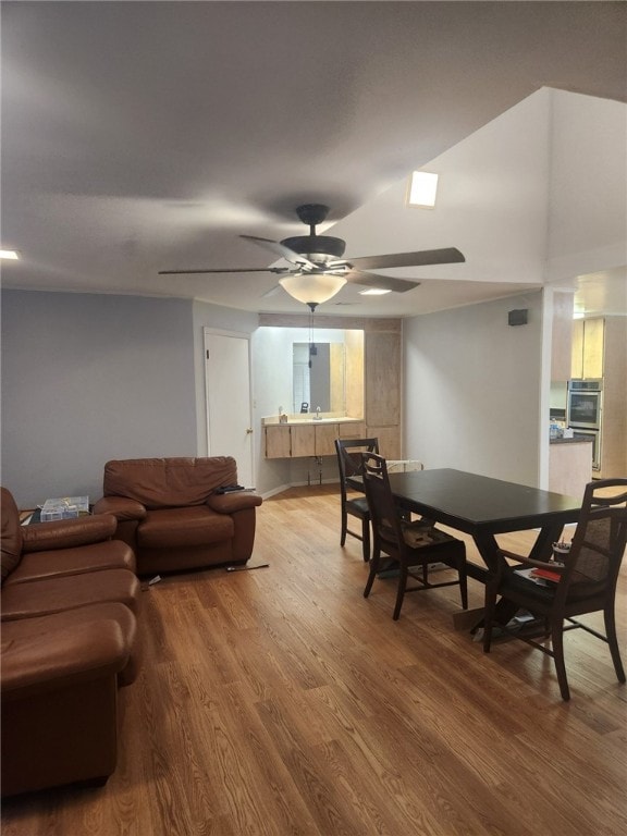 dining room with hardwood / wood-style floors and ceiling fan