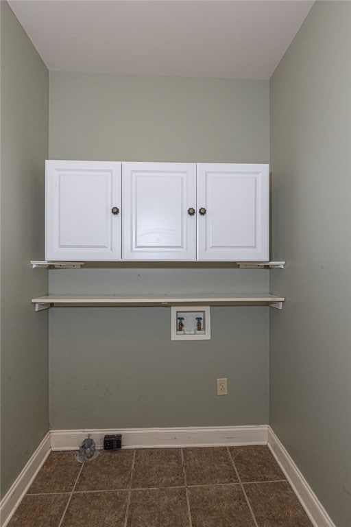 washroom with cabinets and washer hookup