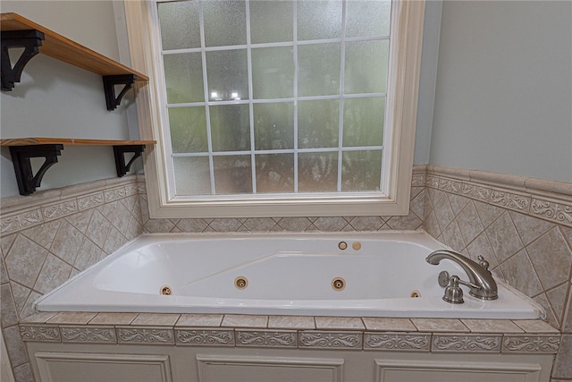 bathroom with a tub to relax in