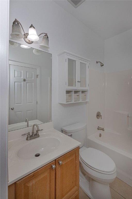 full bathroom featuring shower / washtub combination, tile patterned flooring, vanity, and toilet