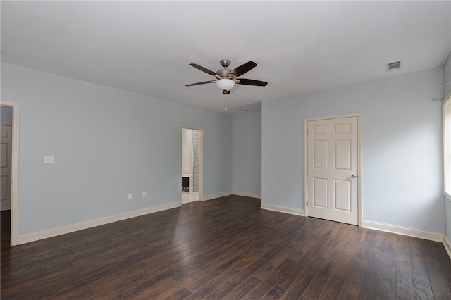 empty room featuring dark hardwood / wood-style floors and ceiling fan