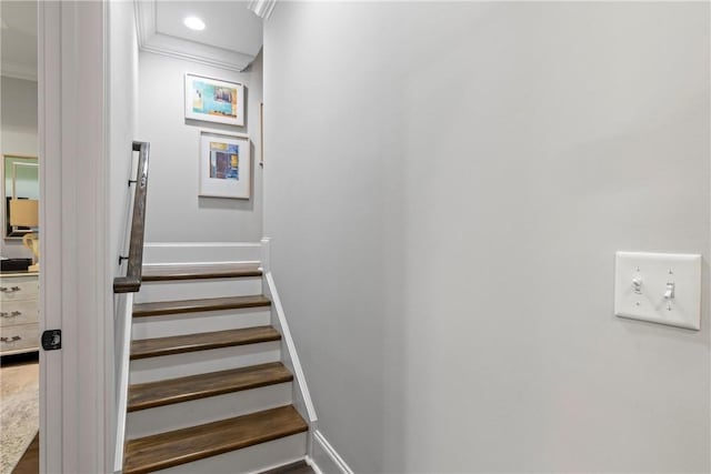 stairs featuring crown molding