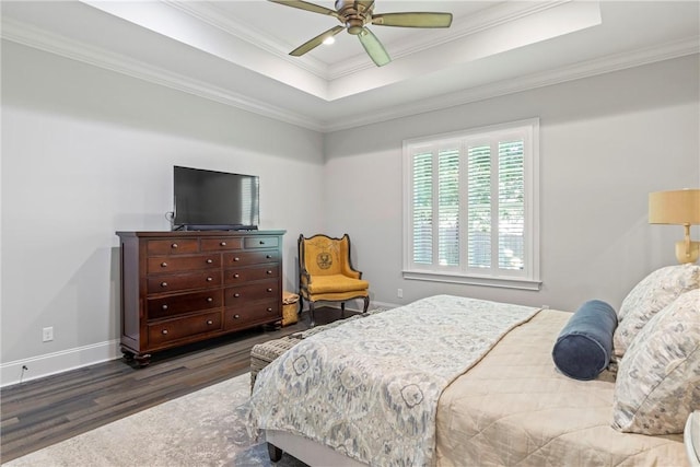 bedroom featuring a raised ceiling, ceiling fan, crown molding, and dark hardwood / wood-style floors