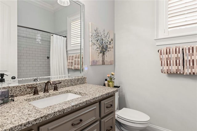 bathroom featuring a shower with curtain, crown molding, vanity, and toilet