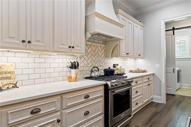 kitchen with premium range hood, crown molding, stainless steel stove, dark hardwood / wood-style floors, and tasteful backsplash