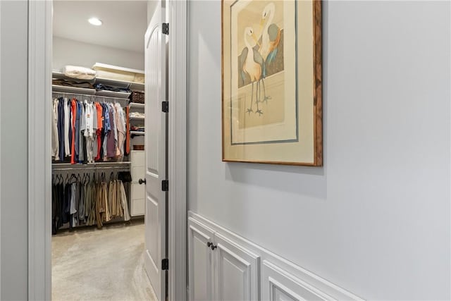 hallway with light colored carpet