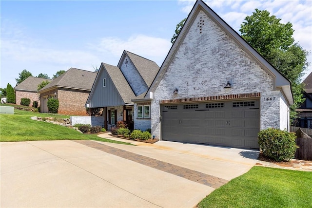 view of front of property featuring a front lawn and a garage