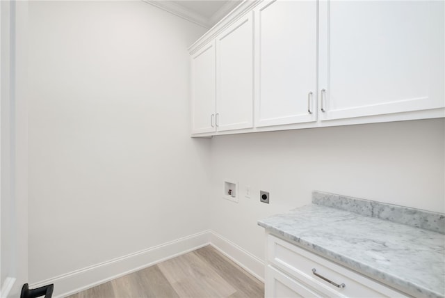 3022 Yards Ln, Opelika, AL 36801 - laundry area featuring hookup for an electric dryer, cabinet space, hookup for a washing machine, light wood finished floors, and ornamental molding