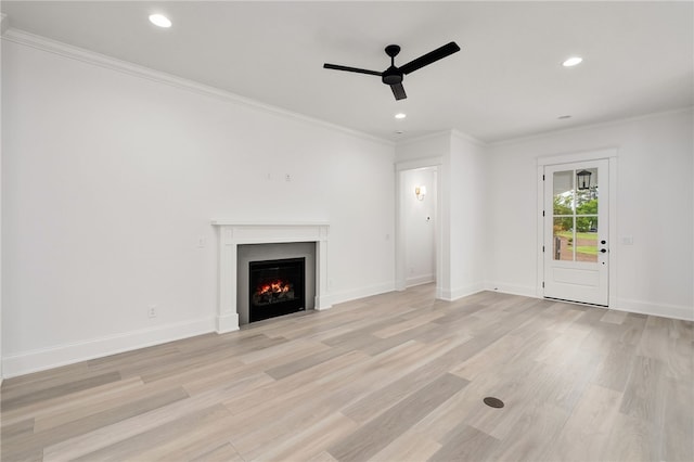3022 Yards Ln, Opelika, AL 36801 - unfurnished living room with a ceiling fan, crown molding, light wood finished floors, a lit fireplace, and recessed lighting