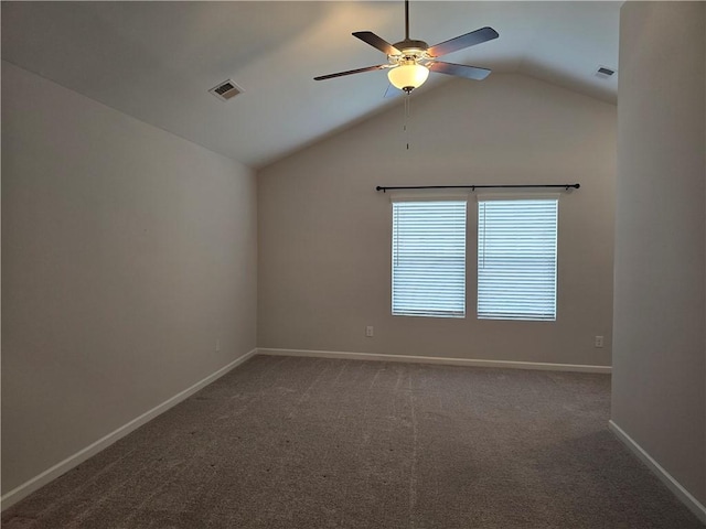 carpeted empty room featuring baseboards, visible vents, lofted ceiling, and a ceiling fan