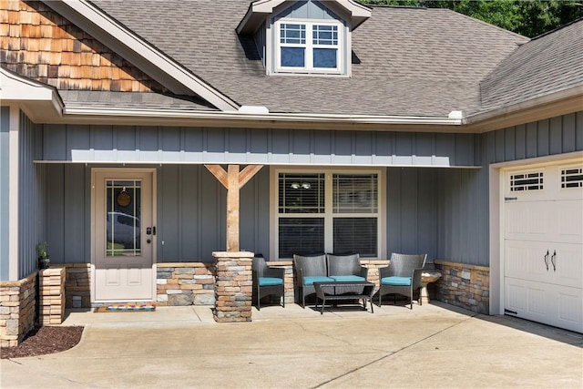 2107 Rockledge Cir, Opelika, AL 36801 - property entrance featuring board and batten siding, roof with shingles, stone siding, an outdoor hangout area, and covered porch