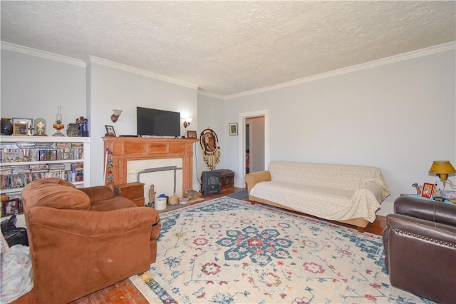 living room featuring a high end fireplace, ornamental molding, a textured ceiling, and wood finished floors