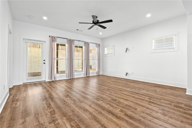 unfurnished room featuring hardwood / wood-style floors and ceiling fan