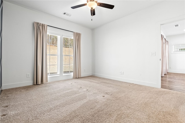 carpeted empty room with ceiling fan