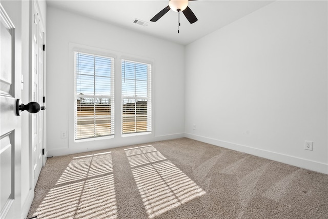 unfurnished room featuring ceiling fan and light carpet