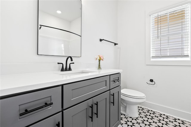 bathroom featuring vanity and toilet