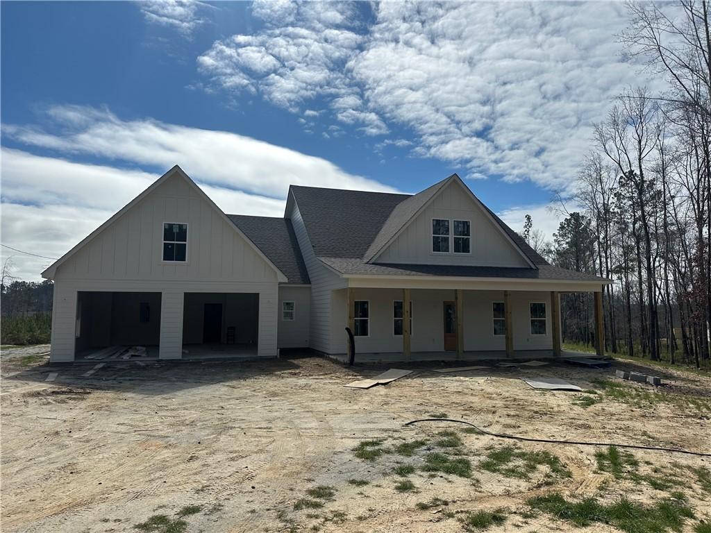 view of front of home with a garage and a porch