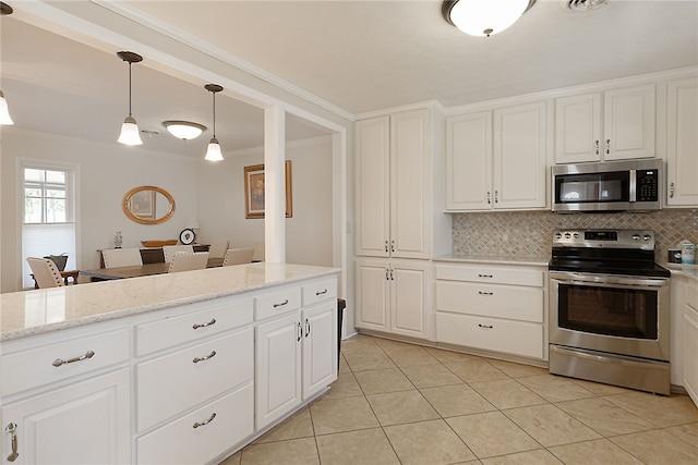 kitchen featuring crown molding, appliances with stainless steel finishes, light tile patterned floors, and tasteful backsplash