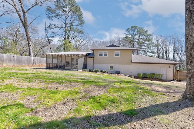 back of house featuring a fenced backyard