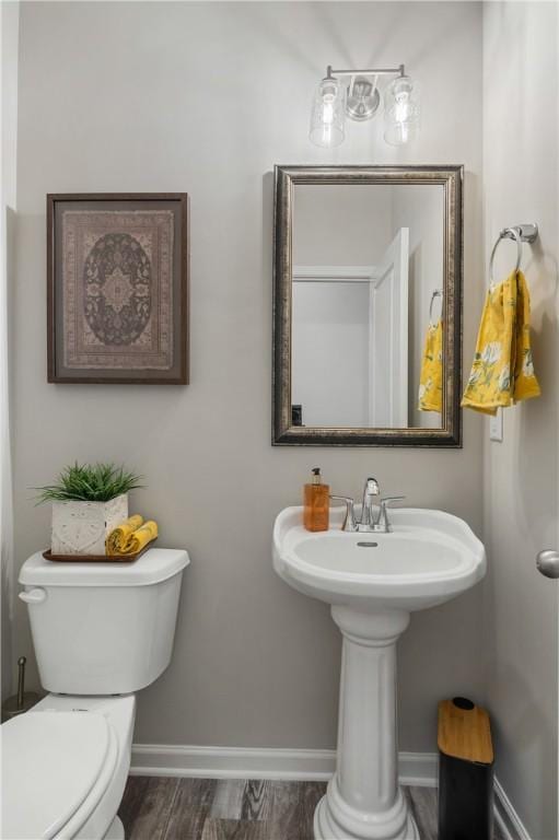 223 Meadowlark Dr, Smiths Station, AL 36877 - bathroom with toilet, baseboards, and wood finished floors
