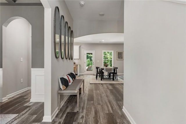 223 Meadowlark Dr, Smiths Station, AL 36877 - hall with dark wood-style floors, arched walkways, and baseboards