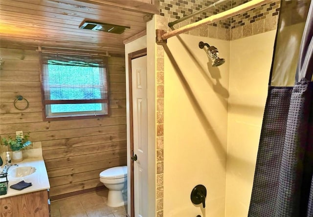 full bathroom with vanity, wooden walls, tile patterned flooring, toilet, and wood ceiling