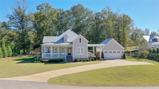 view of front of home featuring a garage, covered porch, and a front lawn