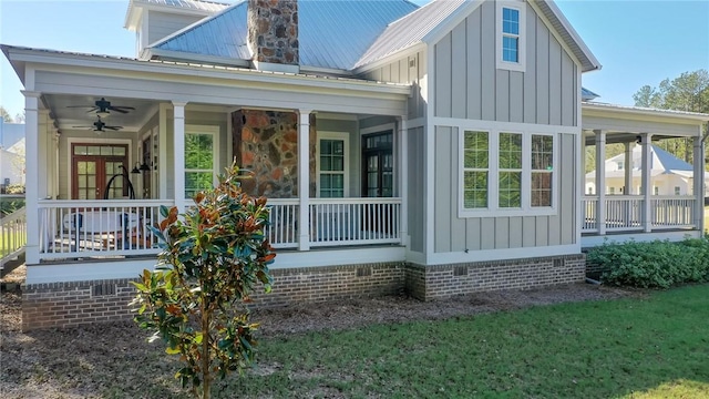 exterior space with ceiling fan and a porch