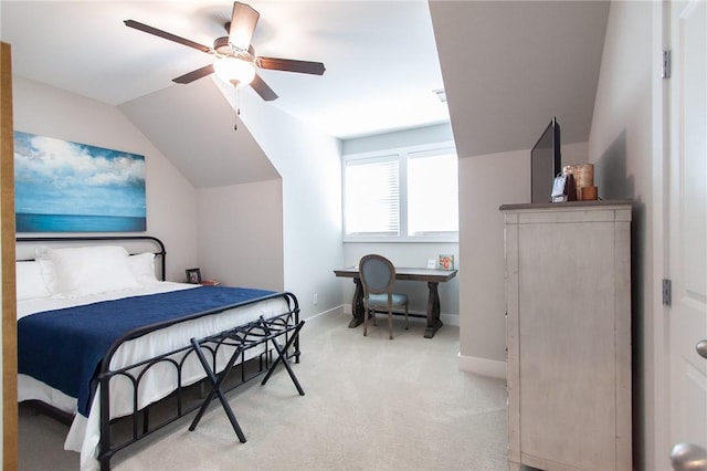 bedroom featuring vaulted ceiling, light colored carpet, and ceiling fan