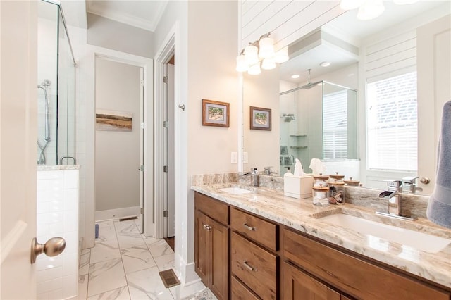 bathroom with ornamental molding, a shower with shower door, and vanity