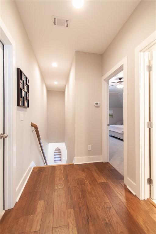 hallway with wood-type flooring